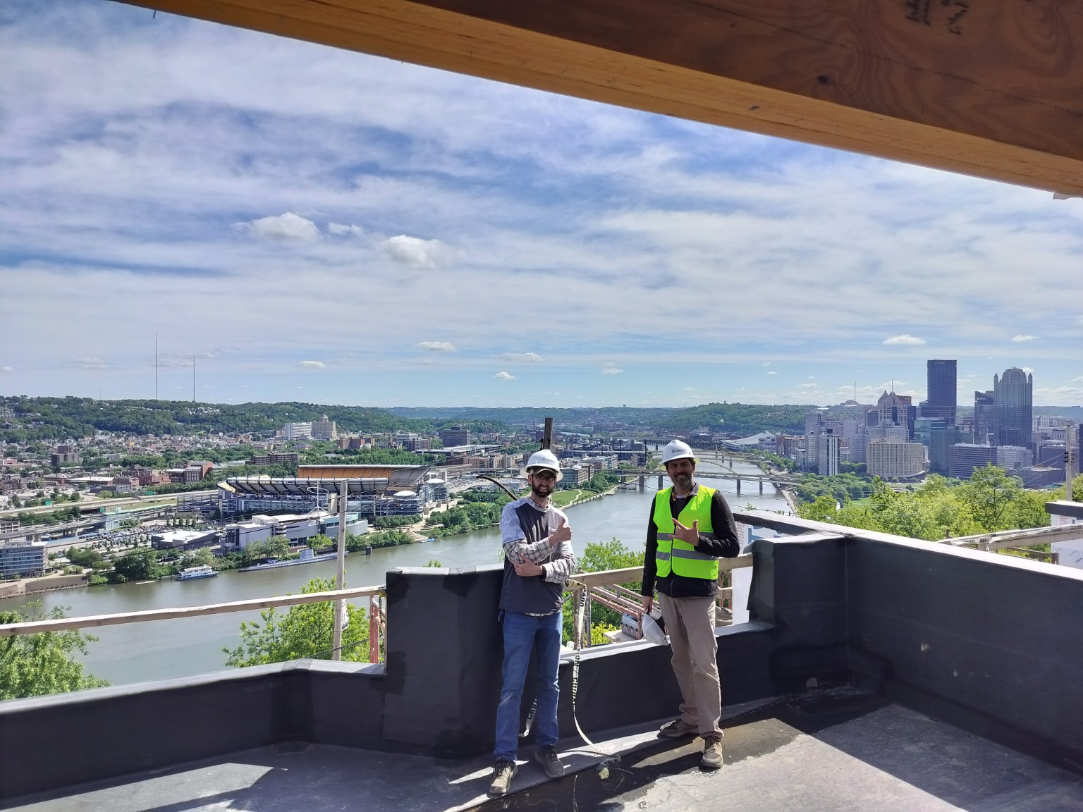 Harmony Home Energy technician performing rooftop field testing